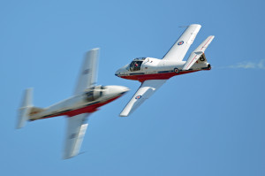 Will they or won't they? (Two aircraft from Canada's Snowbirds aerobatic team flying the Tutor aircraft.)