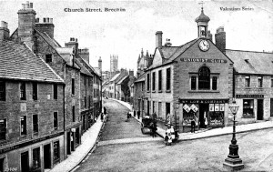 Church Street, Brechin, post card circa 1905. Colin Stevens' Collection (Purchased 2003). The "Unionist Club" / "W S LOW & COMPANY" (grocer apparently) and A. Belford, Baker. Another example of this card was postally used in 1909. Published by Valentine. The building with the clock is now the City's Museum. The clock was still there in 2005.