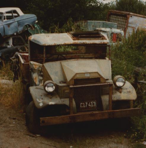 Derelict army truck in junk yard.
