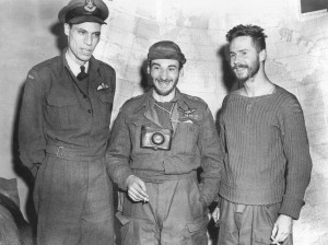 Three military men standing in a group. 