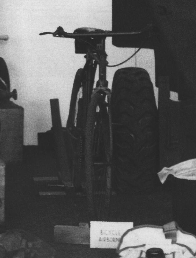 Army bicycle on display in a stand.