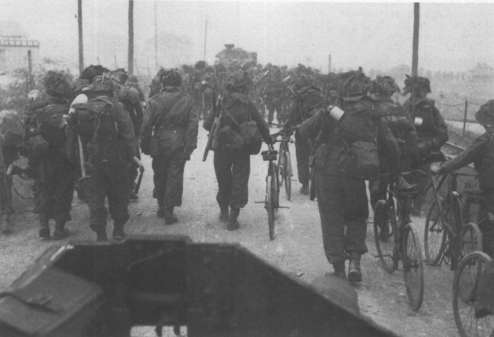 BSA Airborne Bicycles in being walked by 2nd Battalion East Yorkshire_to Collevlle-sur-Mer in Normandy. D-Day, June 6, 1944.