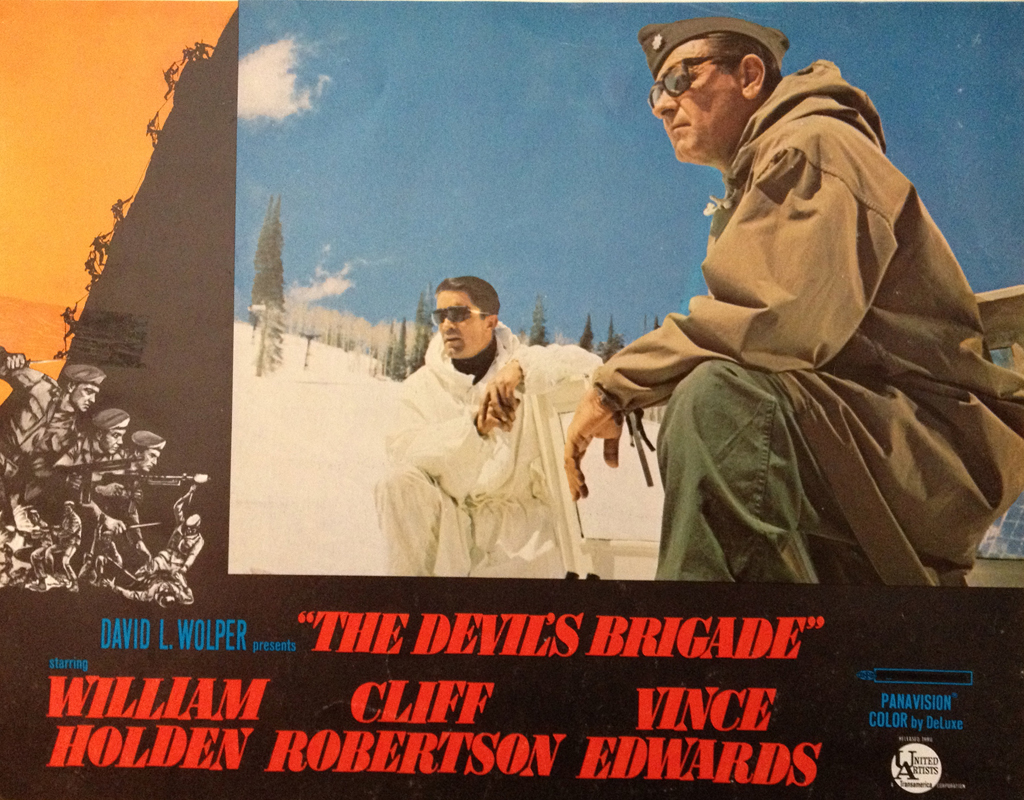 Movie lobby card showin two soldiers in the snow. Devil's Brigade movie lobby card