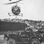 Canadian Army Ferret Scout Car 54-82542 shown in Germany with Canadian Army helicopter hovering overhead. Cdn Army Journal 1963 Vol XVII No2 p69
