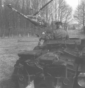 Ferret and helicopter, Canadian Army, Germany,1964. (NATO photo 3906-12)