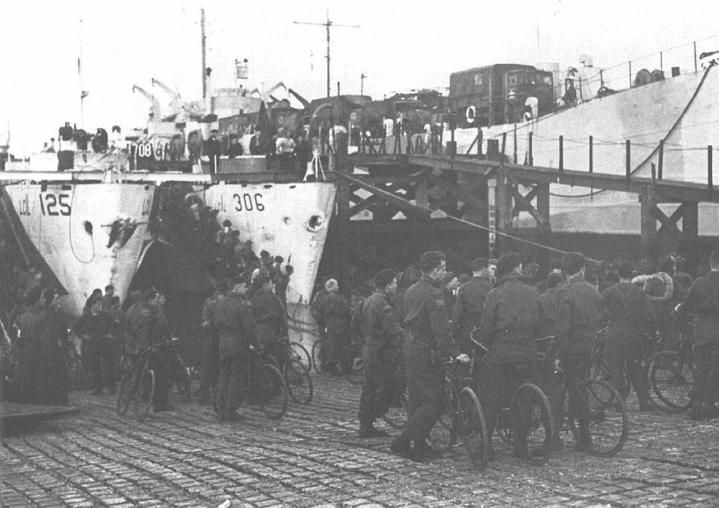 Highland Light Infantry Regiment loading onto landing ships with their BSA Airborne Bicycles (Canadian Army Photo - Library and Archives Canada PA132812)