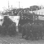 Highland Light Infantry Regiment loading onto landing ships with their BSA Airborne Bicycles (Canadian Army Photo - Library and Archives Canada PA132812)