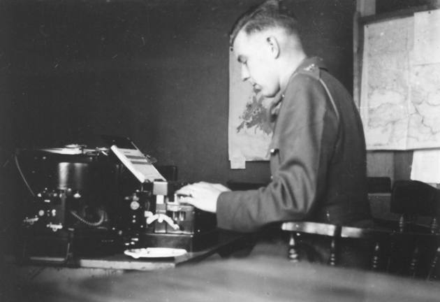 Young officer typing at a code or cypher machine. Lieutenant A. H. Stevens typing on a code or cypher machine (?) - X in Saint John's, Newfoundland in 1942. At Winterholme, with Force "W" Headquarters.