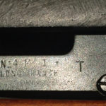 No. 4 MK. I* (T) made by SAL at Long Branch and later issued to the Indian military. The left side of the body has "No.4 MK. I* T" over "LONG BRANCH" over the year 1944. Note that Long Branch is two words.