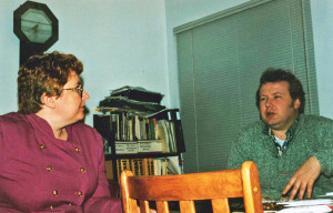 Woman and man seated at a tble, talking. Rob Stevens in discussion with Marjorie