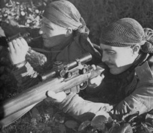Observer with binoculars and sniper with rifle. 1944 Canadian snipers, Belgium.
