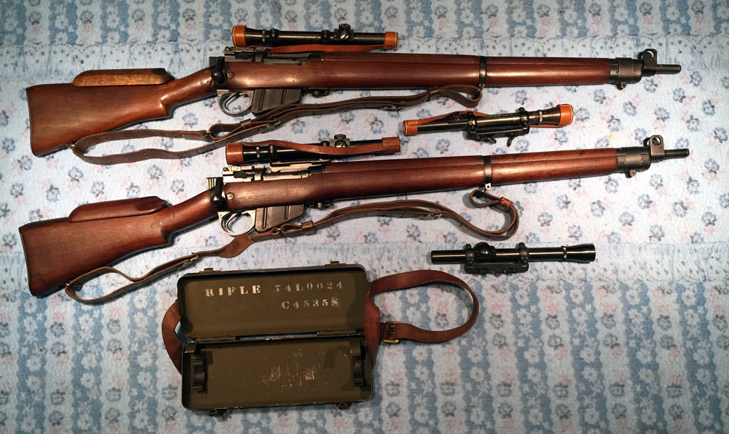 Long Branch No. 4 MK.I* (T) Trade Pattern. Two of the 350 sniper rifles built by Canada that were fitted with U.S. made Lyman Alaskan No. 32 TP MK. I scope. Both sets are matching. The two "orphaned" scopes are originals. The upper one is in a Roger Payne replica slide and the bottom one is in an original slide. The scope case C No. 18 MK. I matched the bottom rifle with its scope. 