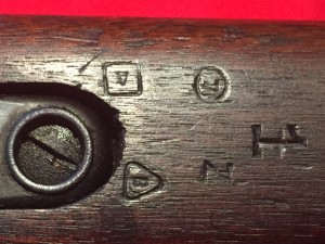 M1903A4 - Five inspector's marks in the underside of the fore stock, just in front of the magazine.