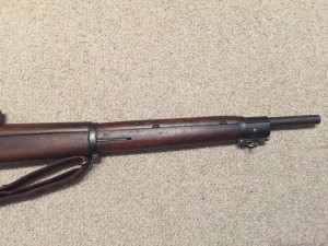 A late 1943 M1903A4 serial number 3422193. This rifle is original with the blued finish but the M73B1 scope has been refurbished by the military. - Right side of front section of rifle.