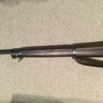 A late 1943 M1903A4 serial number 3422193. This rifle is original with the blued finish but the M73B1 scope has been refurbished by the military. - Left side of front section of rifle.