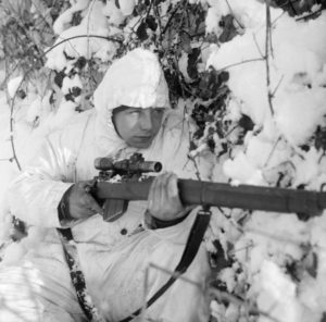 British 6th Airborne Division combat patrol. Sniper. His magazine is not seated properly and is ready to fall out.