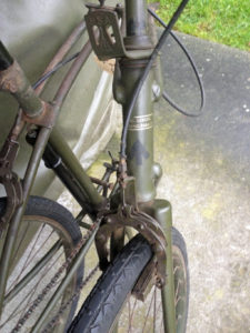 British Army BSA airborne bicycle, 2nd model, made circa 1943 serial number R37618 - folded position showing detail of front brake and decals (transfers).