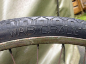 British Army BSA airborne bicycle, 2nd model, made circa 1943 serial number R37618 - An original WAR GRADE tire marking showing the raised marking "WAR GRADE". Rubber was in short supply as the Japanese had captured the Malayan rubber plantations in 1941.