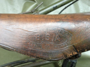 British Army BSA airborne bicycle, 2nd model, made circa 1943 serial number R37618 - Detail of BSA MODEL 40 marking on saddle (seat). "MADE IN ENGLAND / B.S.A. / MODEL 40 NUMBER"