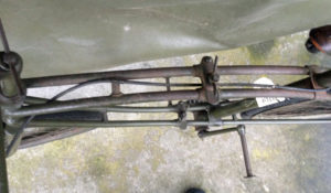 British Army BSA airborne bicycle, 2nd model, made circa 1943 serial number R37618 - Detail of the two frame hinge points for folding and the large wing-nuts. Also the push in peg pedals.