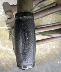 British Army BSA airborne bicycle, 2nd model, made circa 1943 serial number R37618 - Detail of left hand grip. Bakelite (?) outer shell over cardboard. BSA logo.