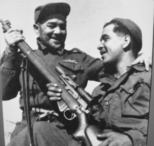 "Pop" Wheeler (left) from the Pioneer Platoon of 1 PPCLI and his son Jake Wheeler, sniper in Sloppy Sam's Sniper Section. Jake has a Canadian made No. 4 MK. I* (T) with C No. 67 MK. I scope. Korea, 1952 by Paul E. Tomelin (L&AC PA 128844 MIKAN 3397766)