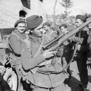 Belgian Commando soldier checking his sniper rifle.