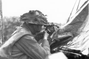 Looking at a British sniper from behind.