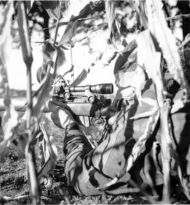 Canadian sniper in a cornfield. Location and date unknown. by Lt Ken Bell L&AC PA 211728