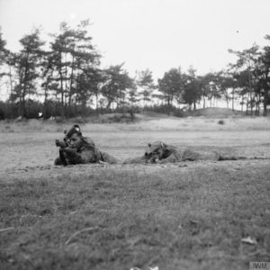 Two snipers demonstrate - left is prone, right is low silhouette Hawkins position 21st Army Group sniping school near Eindhoven, 15 October 1944. © IWM (B 10972)