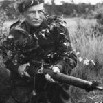 1933-10-09 ? A sniper of the Scout Platoon, Queen's Own Cameron Highlanders of Canada at Brasschaat, Belgium. DND photo (ref. The Lion Rampant p. 72)