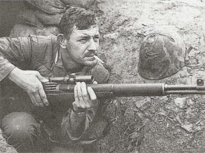 U.S. sniper Boitnott in Korea armed with an M1C sniper rifle fitted with an M81 or M82 Lyman scope.