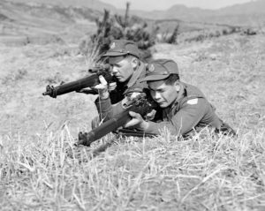 Two Canadian snipers in Korea. The one on our left has a Canadian made No. 4 MK.I* (T) with a Canadian R.E.L. made C No. 67 MK. I scope. The man on the viewer's right (lower than the other man( has a Canadian made No. 4 MK. I*(T) Trade Pattern with U.S. made Alaskan No. 32 TP MK. I scope.