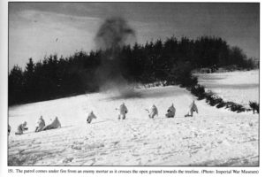 1945 JAN 14 - British 6th Airborne Division fighting patrol which includes a young sniper. Ardennes. Coming under enemy mortar fire.