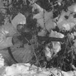 British 6th Airborne Division combat patrol. Sniper. His magazine is not seated properly and is ready to fall out.