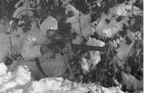 British 6th Airborne Division combat patrol. Sniper. His magazine is not seated properly and is ready to fall out.