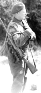 RCEME soldier with a cut-down No. 4 MK. I (T) or No. 4 MK. I* (T). Some people thought it was an Experimental Scout sniper rifle but others do not accept this. (National Archives)