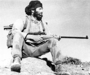 Special Air Service (SAS) sniper with L42A1 in Dhofar Province, Oman about 1974. He also has an M79 Grenade Launcher on his rucksack. (TMSS1914 p60)