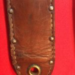 USMC Stiletto scabbard - front view of lower end showing the large grommet. This 4th version of scabbard does not have the metal plates. Colin M Stevens' Collection