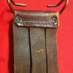 USMC Stiletto scabbard - back view of top showing the M1910 belt hook and belt slots. The two prongs of the rivet for the retaining strap are also visible. - Colin M Stevens' Collection