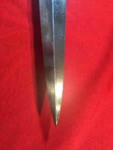 USMC Stiletto etching side of knife showing the undamaged blade tip. - Colin M Stevens' Collection