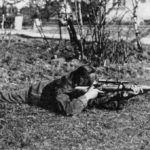 WWII British sniper in the regular prone shooting position. WBSTTR - Shore 1948 FP 119 BOTTOM