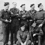 Some of the staff of the sniping school in Germany, during July-August 1945. The Scottish bonnets are those of the Lovat Scouts with blue and white dicing. Author Captain C. Shore is in the centre of the back row. WWII British snipers WBSTTR - Shore 1948 FP 134