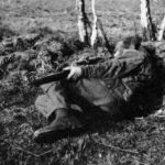 WWII British sniper demonstrating an unconventional shooting position, one often used in British match rifle competitions. It is a good position to drop into for a quick shot from sloping ground or to fit into a small shell hole or hide. WBSTTR - Shore 1948 fp 135 bottom