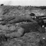 WWII British "sniper pair in training. "One shooting, one observing with telescope ... around cover. Notice the tremendous difference the sniper smock and camouflage veil man in a man's 'merging into the ground' compared with the battledressed and bareheaded observer. WBSTTR - Shore 1948 fp 263