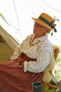 Fort Nisqually Brigade Days 2016 AUG (21) - Sue Morhun relaxing at her tent.