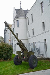 (4) One of the guns of 15 Field Regiment, Royal Canadian Artillery, outside the Seaforth Armoury entrance.