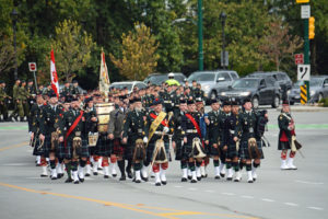 (11) The Seaforth Highlanders of Canada approaching the Seaforth Armoury. The Commanding Officer is peeling off on the right to take up his position front and centre when he halts the parade.