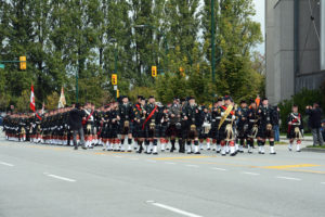 (13) The Seaforth Highlanders of Canada approaching the Seaforth Armoury. The Commanding Officer is on the viewer's right to take up his position front and centre when he halts the parade.