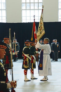 Padre Jim Short returning the Colours to the Colour Party after the Drumhead Ceremony. The Seaforths received the new Battle Honour of AFGHANISTAN.
